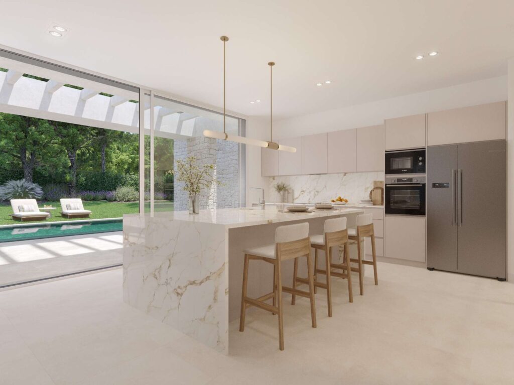 Cocina con isla de una villa de Boadilla, abierta al jardín